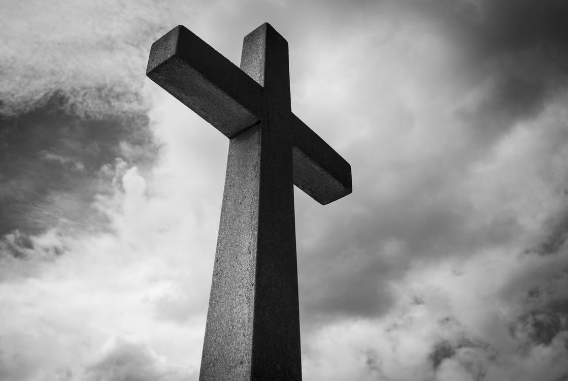 Cross against a cloudy sky
